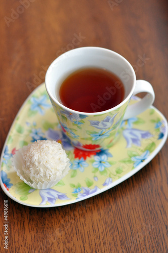 Small cup of tea and a raffaello