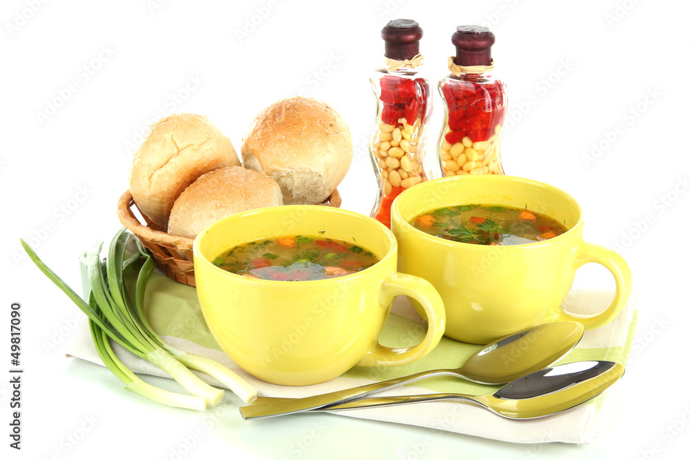 Fragrant soup in cups isolated on white Fragrant soup in cups isolated on white