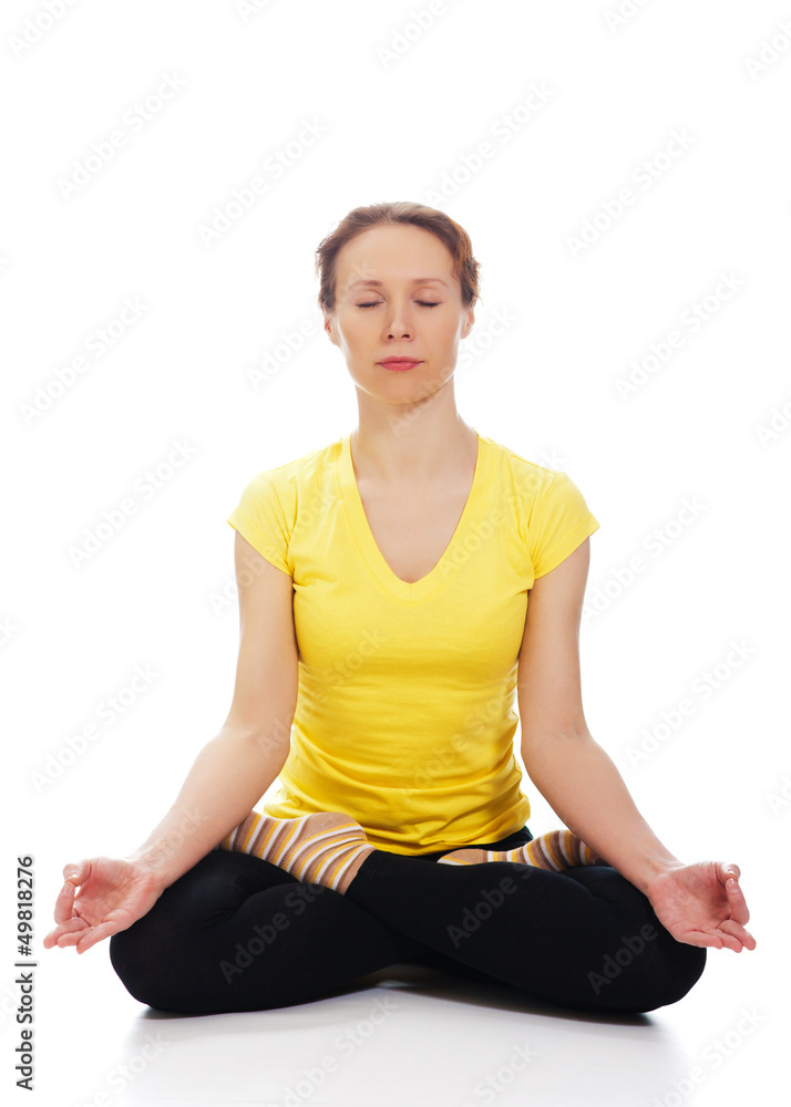 Young woman doing yoga exercise