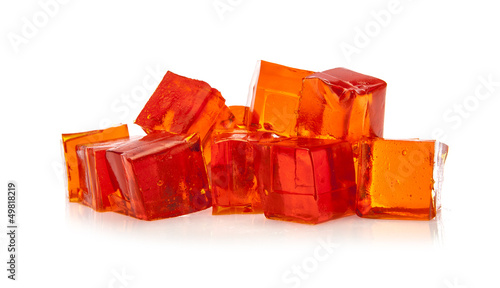 Orange jelly cubes on white background