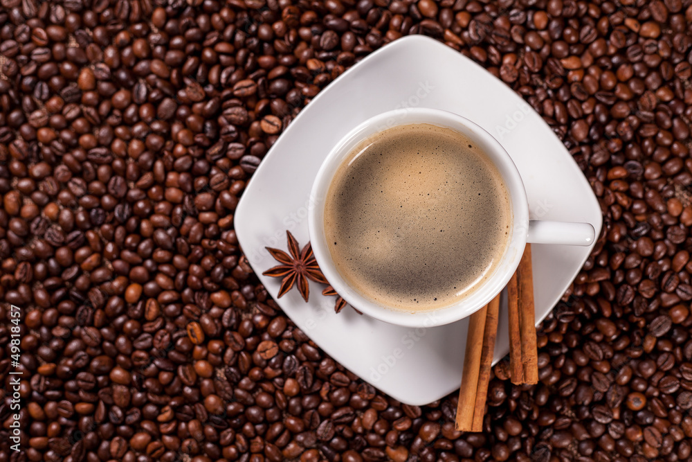 High angle view of a coffee cup with cinnamon High angle view of a coffee cup with cinnamon
