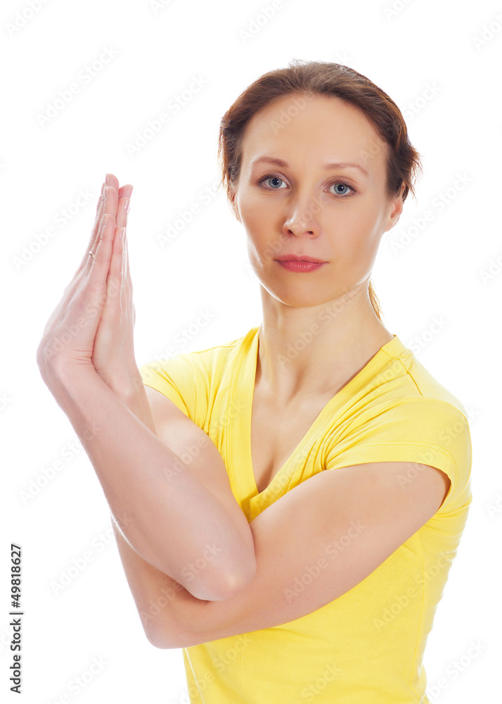 Young woman doing yoga exercise