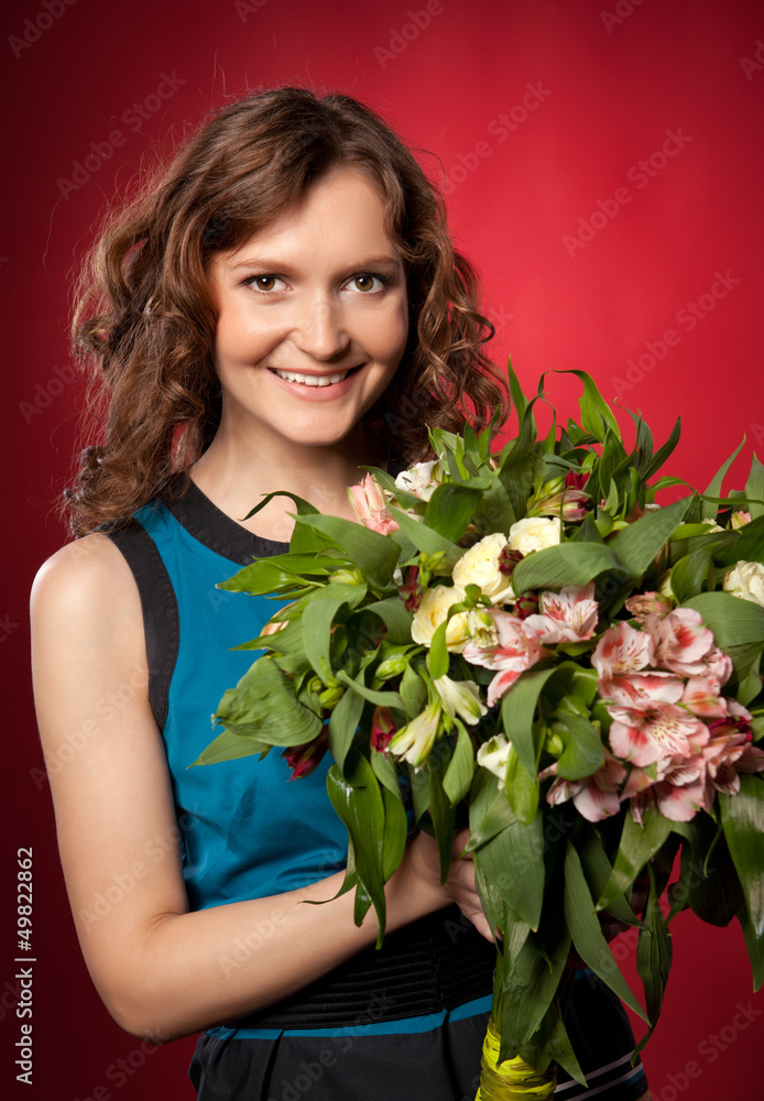Portrait of pretty brunette holding bouquet of flowers Portrait of pretty brunette holding bouquet of flowers