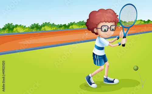 A boy holding a racket
