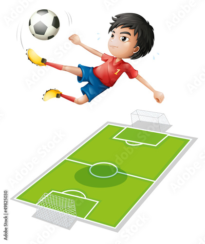 A boy kicking the ball