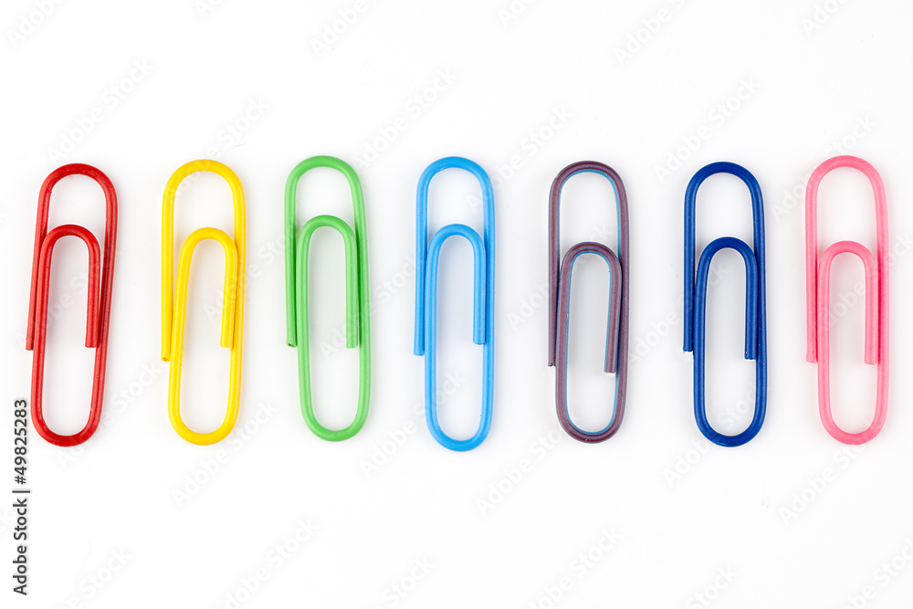 colorful paper clips in white background colorful paper clips in white background