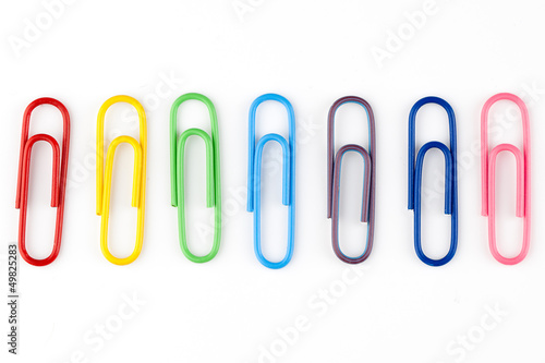 colorful paper clips in white background