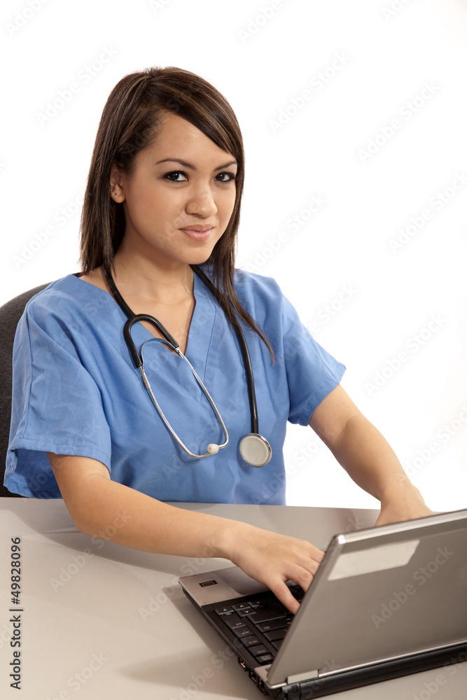 Young asian filipino nurse working on laptop Young asian filipino nurse working on laptop