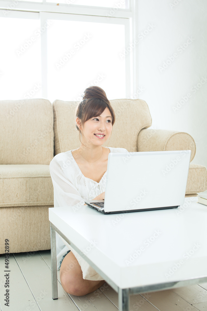 Beautiful asian woman using a laptop computer Beautiful asian woman using a laptop computer