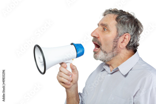 An elderly man says something into a megaphone