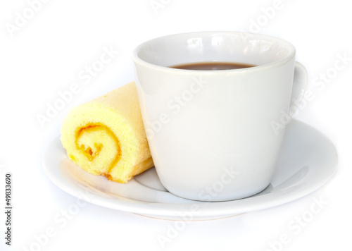Fototapeta Naklejka Na Ścianę i Meble -  Coffee cup with orange cake roll.