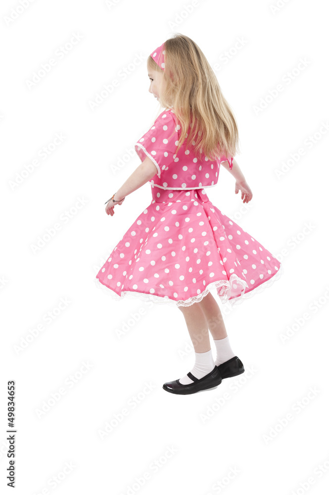 dancing little girl in pink dress