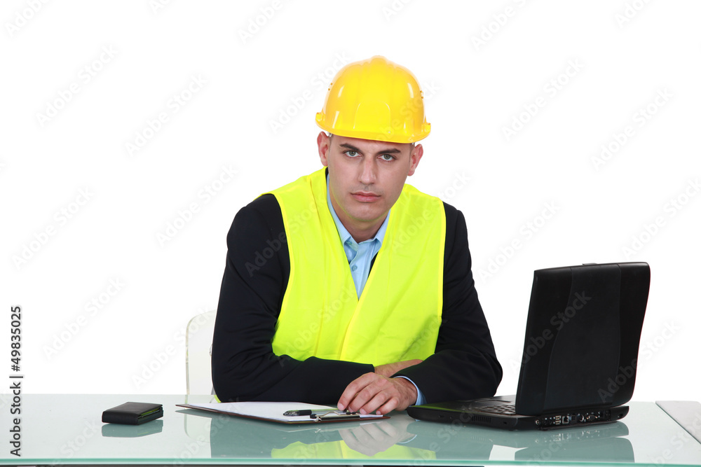 helmeted foreman with laptop helmeted foreman with laptop