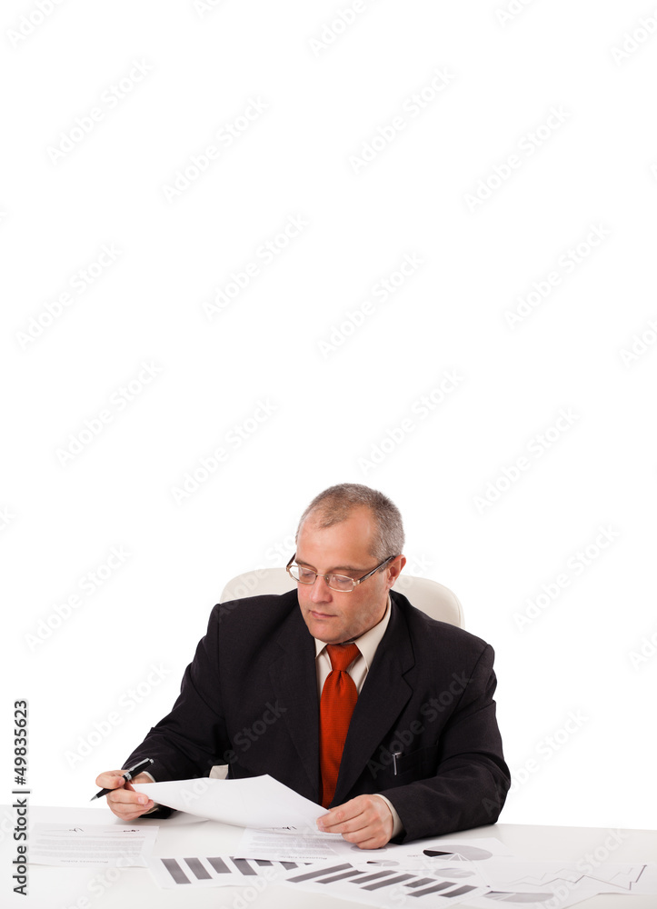 businessman sitting at desk with copy space businessman sitting at desk with copy space
