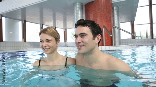 Couple enjoying bathtime in spa resort photo