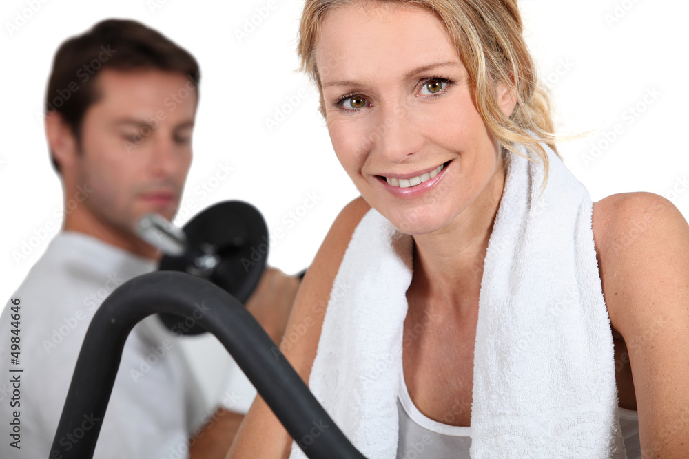 Man and woman working out in gym Man and woman working out in gym