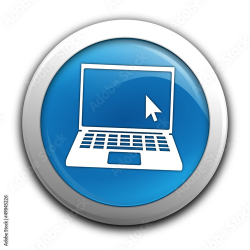 ordinateur portable sur bouton bleu