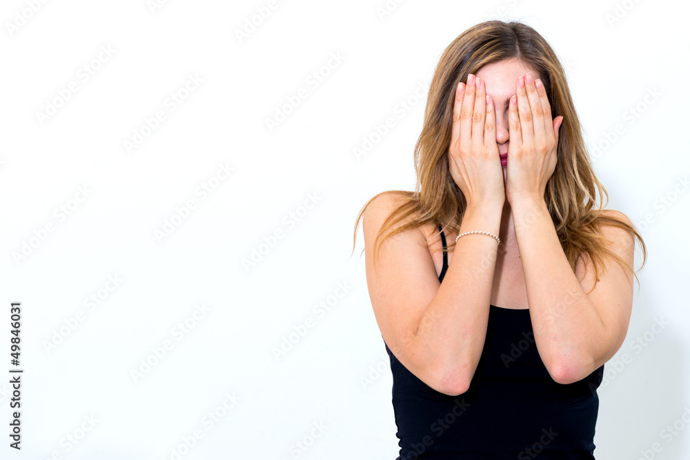 woman shuts face with hands woman shuts face with hands