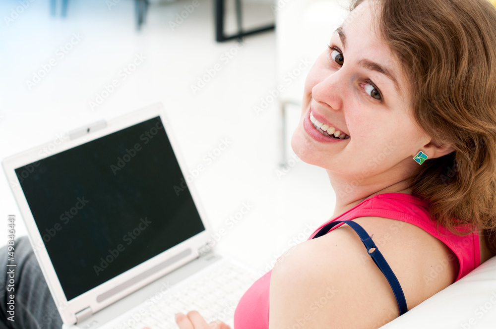 woman sitting comfortable with laptop on couch woman sitting comfortable with laptop on couch