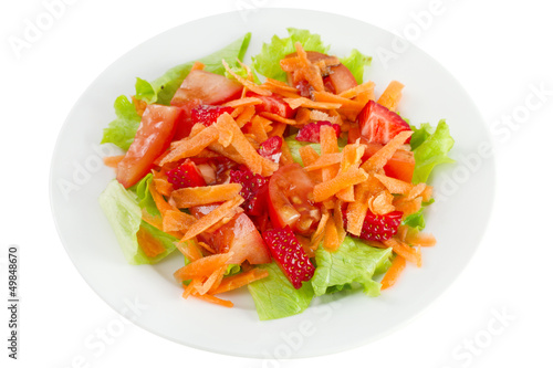 salad with strawberry on the plate on white background