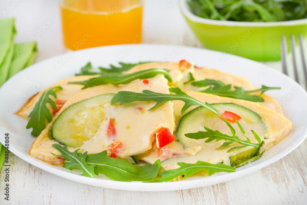 omelet with zucchini on the plate and orange juice omelet with zucchini on the plate and orange juice