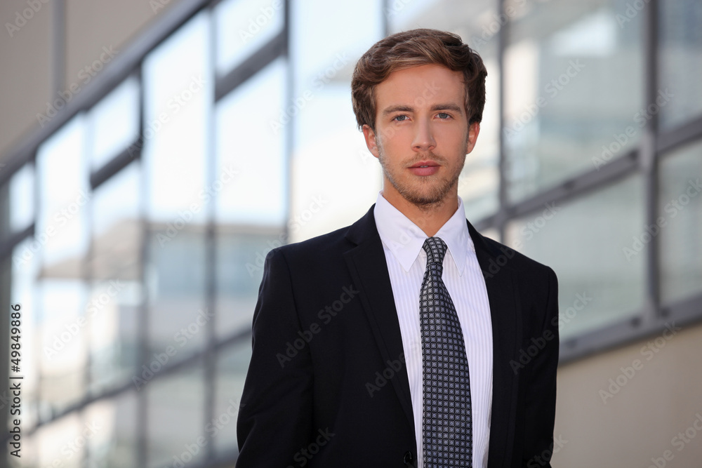 Young salesman in smart suit Young salesman in smart suit