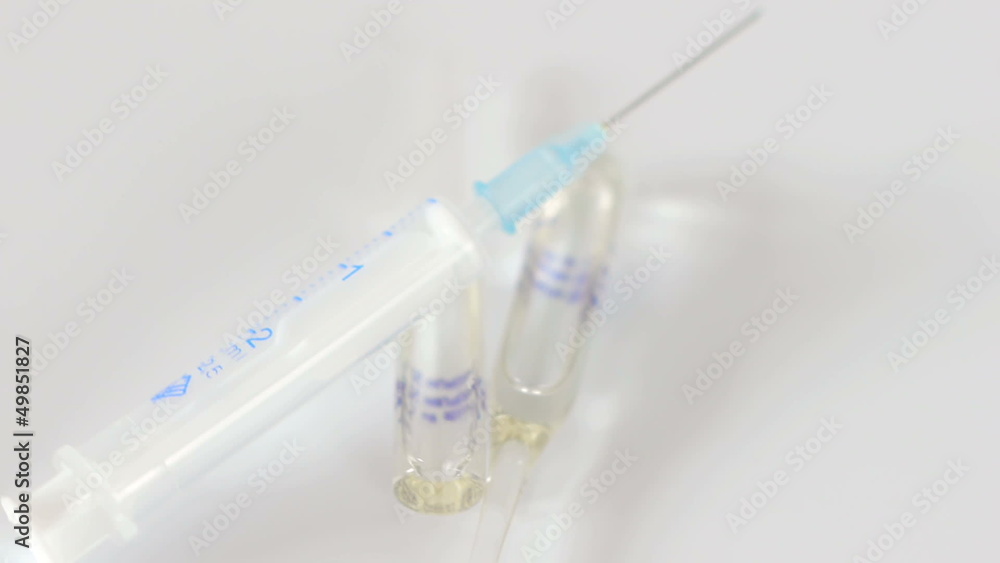 Syringe and vial rotate. Macro, seamless looping. Syringe and vial rotate. Macro, seamless looping.