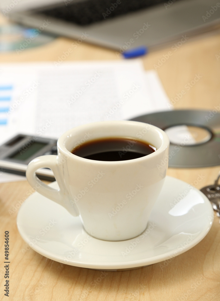 Cup of coffee on office desktop close-up Cup of coffee on office desktop close-up