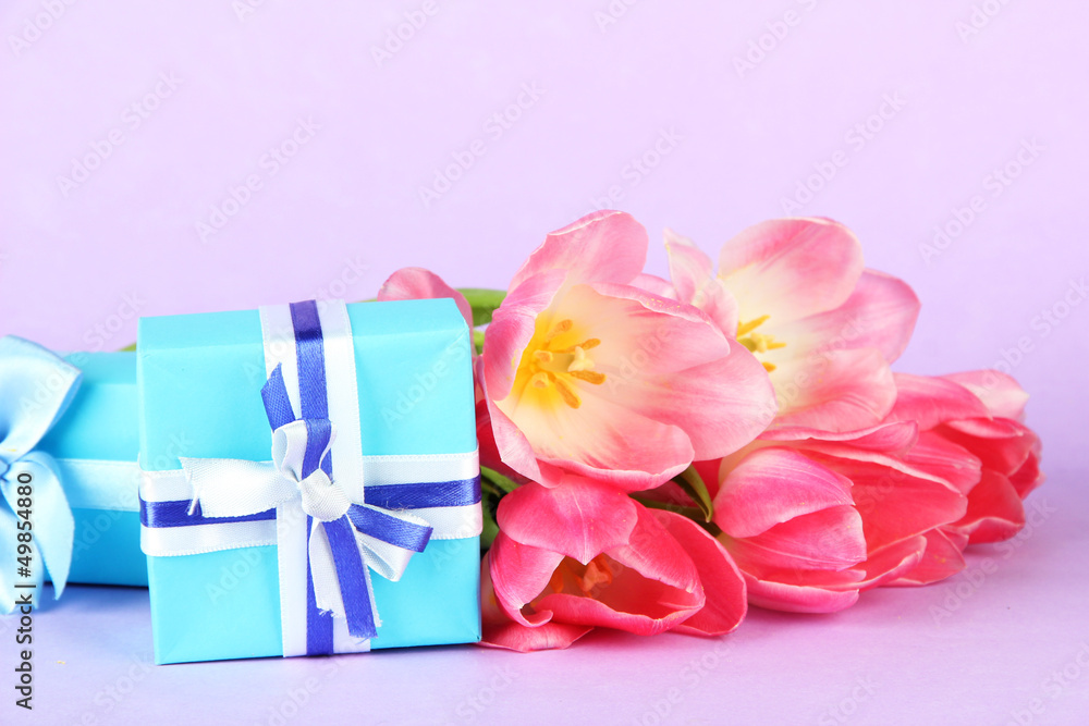 Pink tulips and gift boxes, on color background Pink tulips and gift boxes, on color background