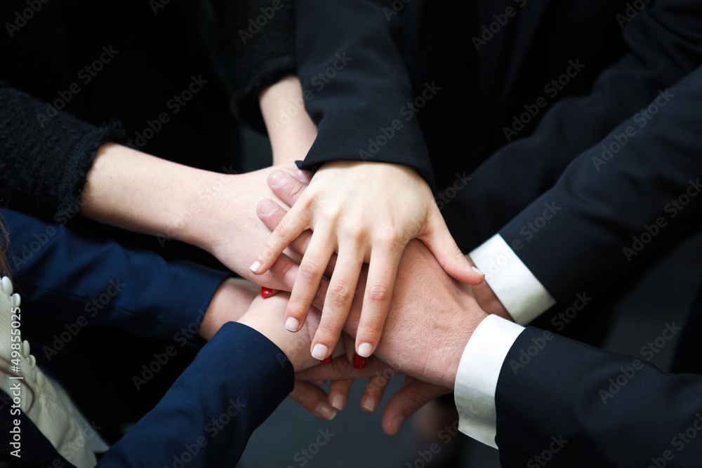 Closeup of pile of hands of business partners Closeup of pile of hands of business partners