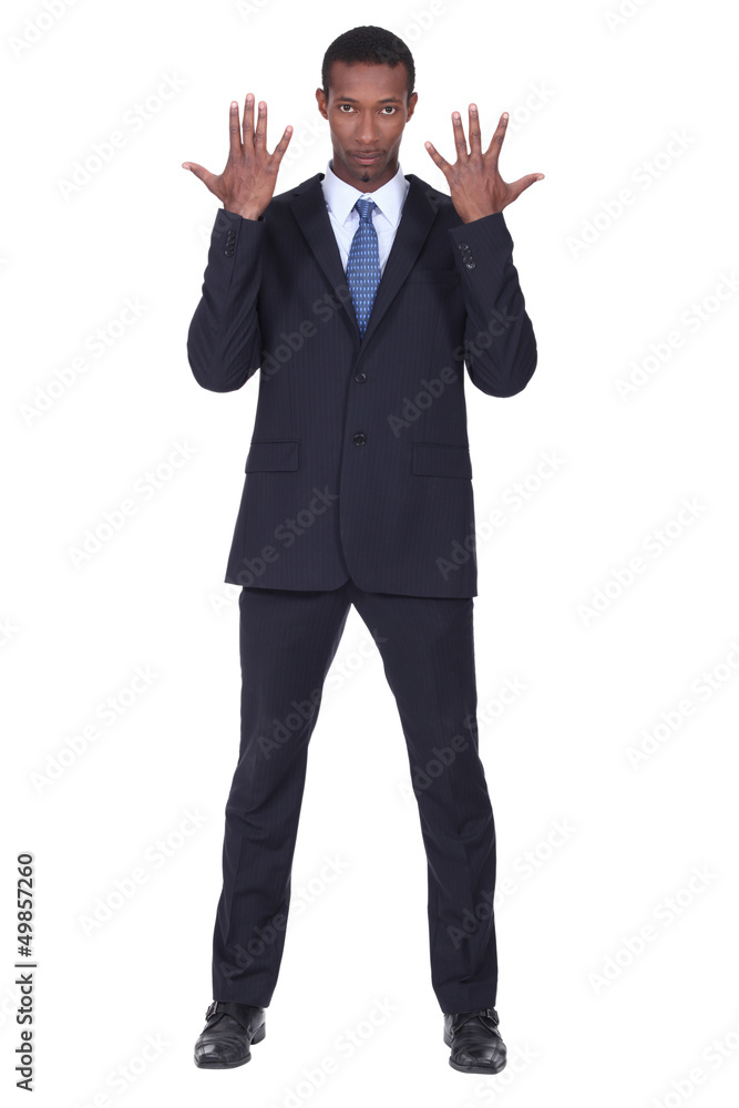 Studio shot of a business man with his hands in the air Studio shot of a business man with his hands in the air