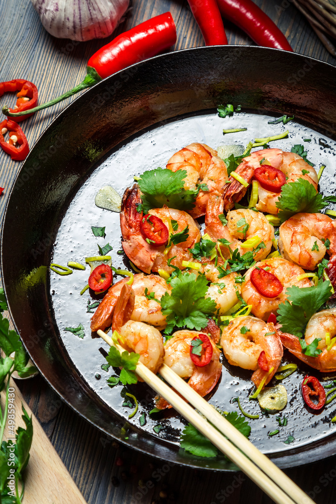 Shrimps on pan with fresh herbs Shrimps on pan with fresh herbs