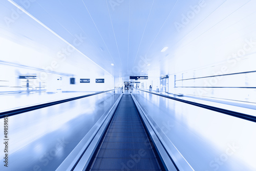 Escalator in modern interior toned