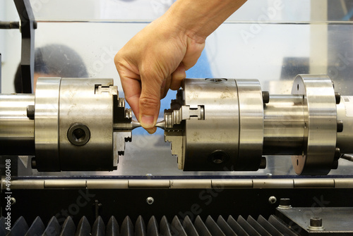 Check the torsion specimen before test on torsion testing machin photo