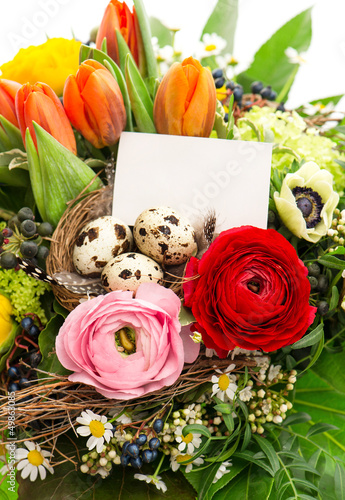 colorful easter flowers bouquet with eggs decoration