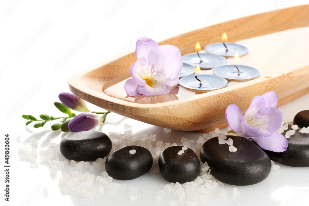 Beautiful spa setting with flowers, isolated on white Beautiful spa setting with flowers, isolated on white