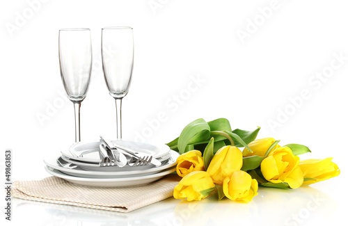 Fototapeta Naklejka Na Ścianę i Meble -  Yellow tulips and utensils for serving isolated on white
