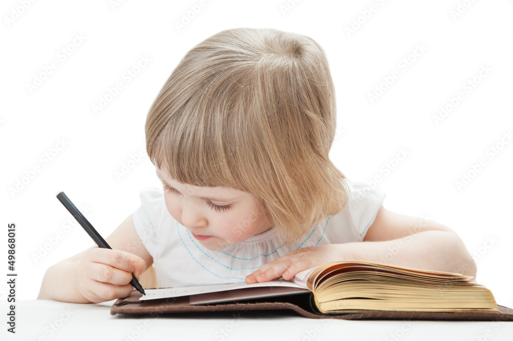 Little girl writing letters with a pen Little girl writing letters with a pen
