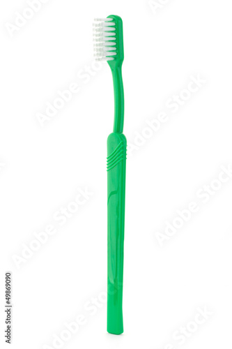 Single green toothbrush on white