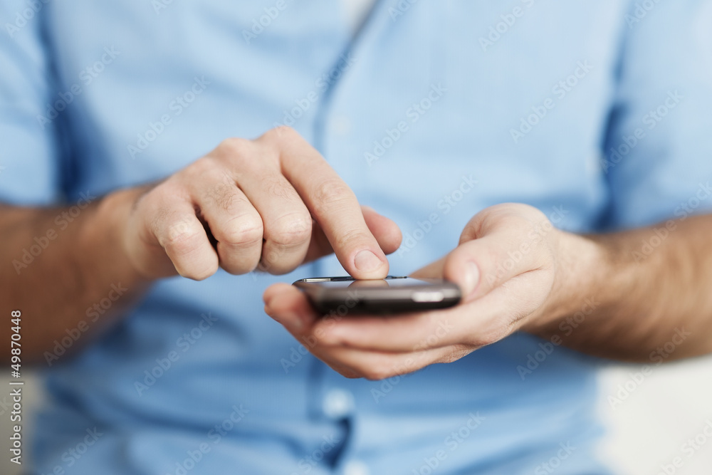 Man texting on mobile phone Man texting on mobile phone