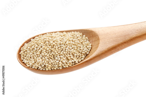 uncooked quinoa in the wooden spoon
