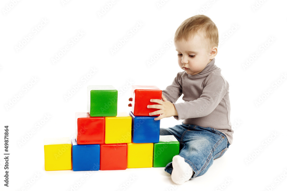 child playing with toy cubes, isolated on white child playing with toy cubes, isolated on white