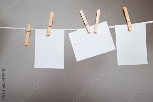 paper cards on clothes-pegs