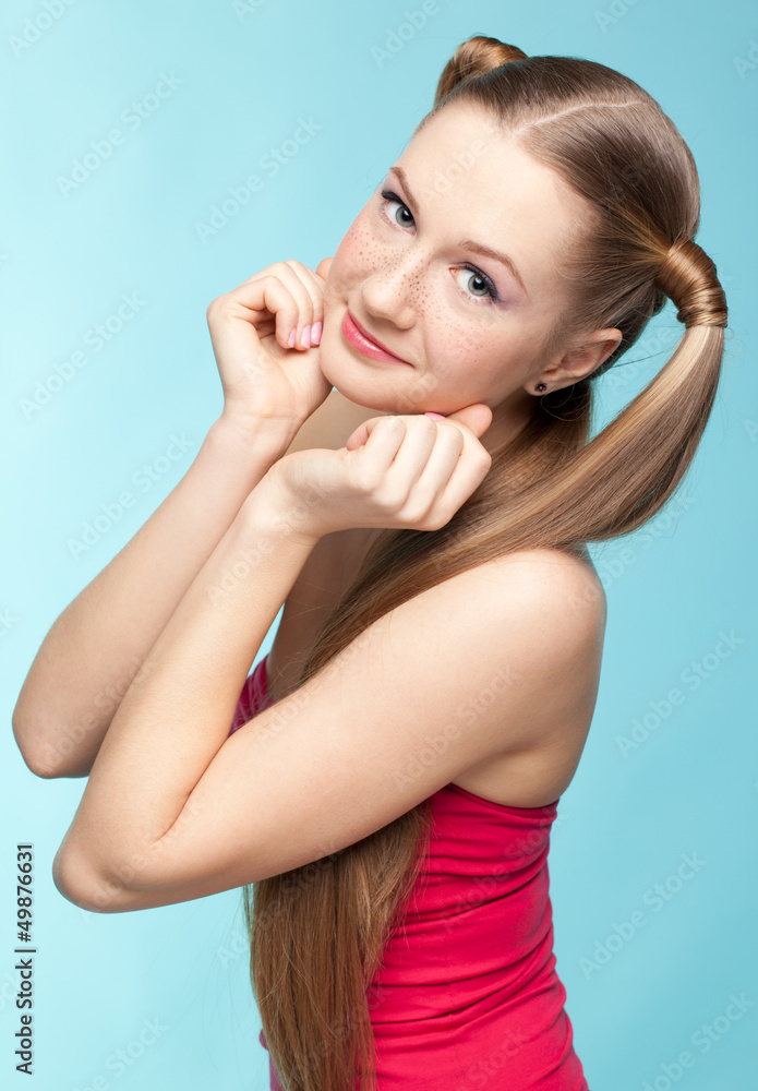 Fototapeta premium Freckled girl in red dress