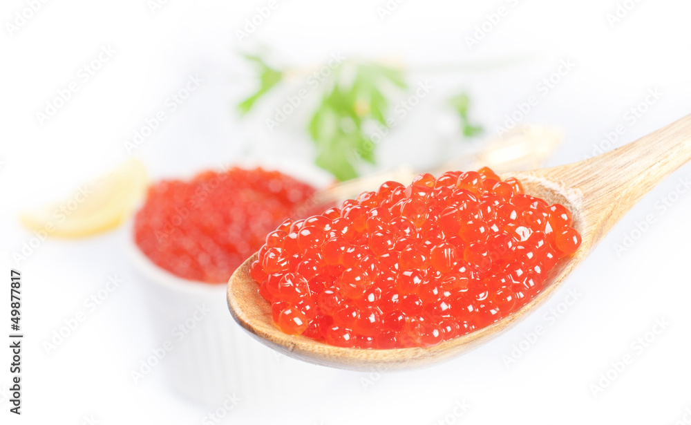 Fresh golden red caviar isolated on white Fresh golden red caviar isolated on white