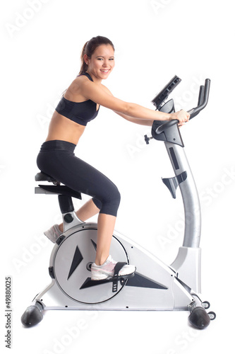 Brunette woman on bike exerciser