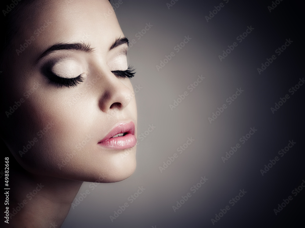 Young woman with beautiful makeup, face close-up. Young woman with beautiful makeup, face close-up.