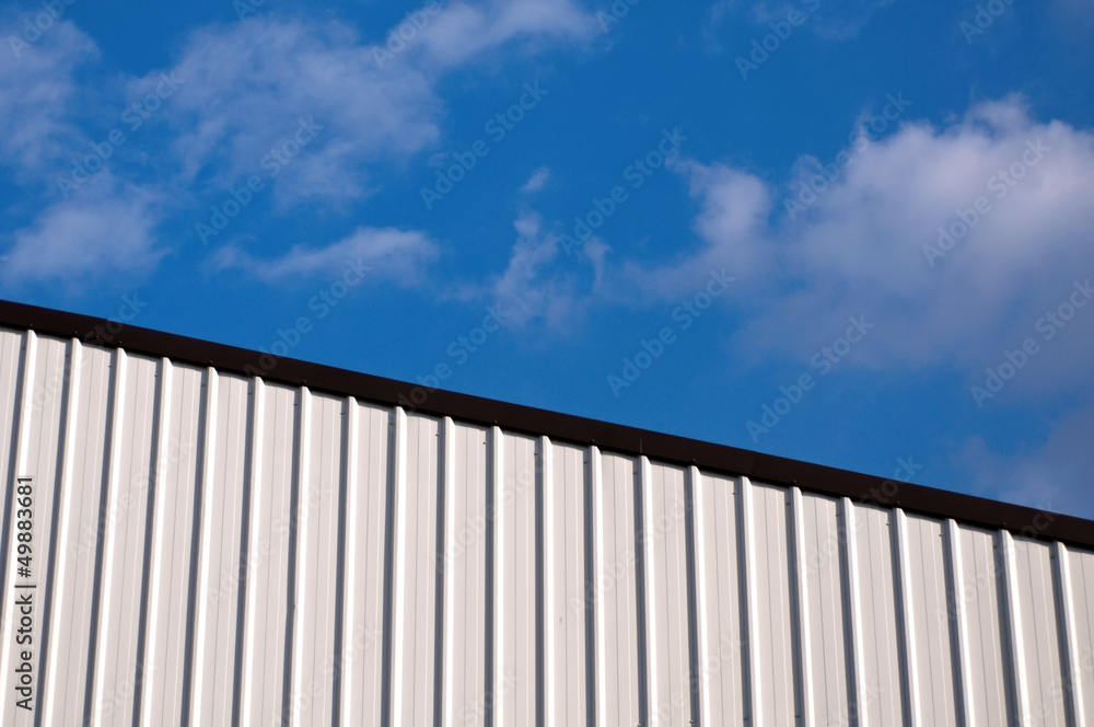 Corrugated Metal Roof against Blue Sky Corrugated Metal Roof against Blue Sky