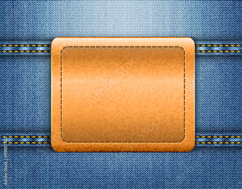 Brown leather label on blue jeans background