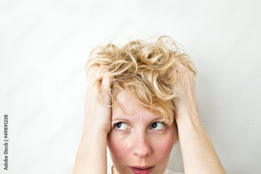 Blond Girl Pulling Hairs and looking left Blond Girl Pulling Hairs and looking left
